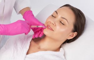 Woman receiving a lip filler treatment